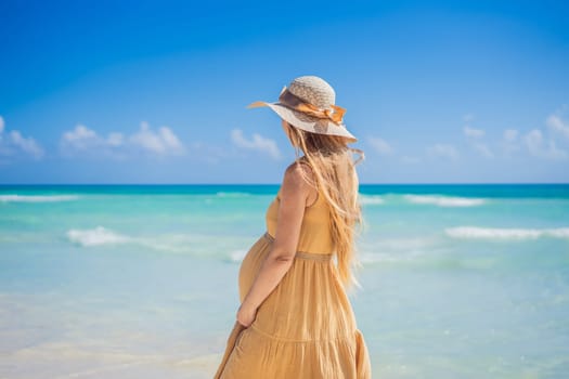 Radiant and expecting, a pregnant woman stands on a pristine snow-white tropical beach, celebrating the miracle of life against a backdrop of natural beauty.