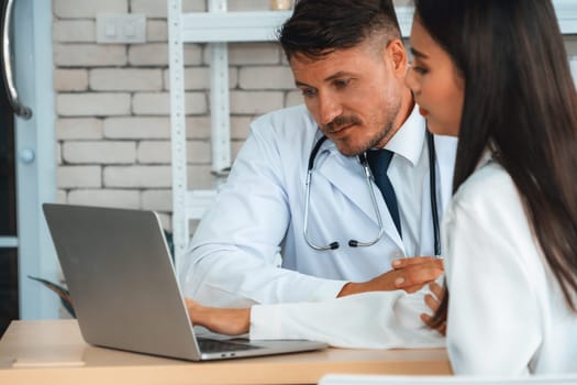 Doctor in professional uniform examining patient at hospital or medical clinic. Health care , medical and doctor staff service concept. Jivy