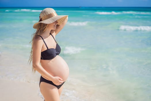 Radiant and expecting, a pregnant woman stands on a pristine snow-white tropical beach, celebrating the miracle of life against a backdrop of natural beauty.