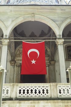 Turkish flag hanging on the window.