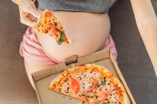 A pregnant woman enjoys a slice of pizza, savoring a moment of indulgence while satisfying her craving for a delightful, comforting treat. Excited Pregnant Young Lady Enjoying Pizza Holding Biting Tasty Slice Posing With Carton Box. Junk Food Lover Eating Italian Pizza. Unhealthy Nutrition Cheat Meal.