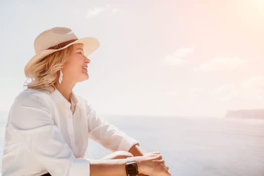 Happy girl doing yoga with laptop working at the beach. beautiful and calm business woman sitting with a laptop in a summer cafe in the lotus position meditating and relaxing. freelance girl remote work beach paradise