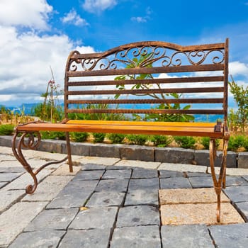 Old vintage bench. Sky on the background