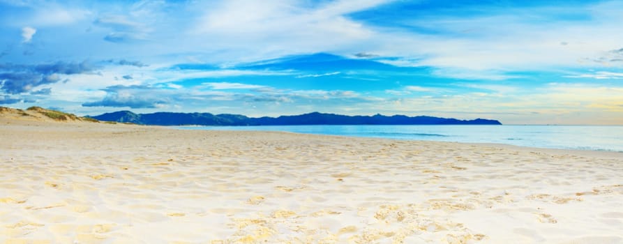 Panorama of the tropical sandy beach at sunrise time