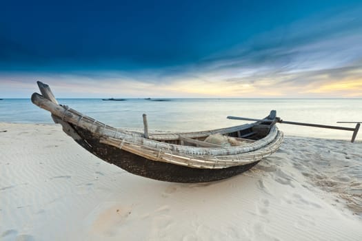Old fisherman boat at sunrise time. Hue province. Vietnam