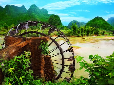 Bamboo water wheel. The use of water power for irrigation. Vietnam