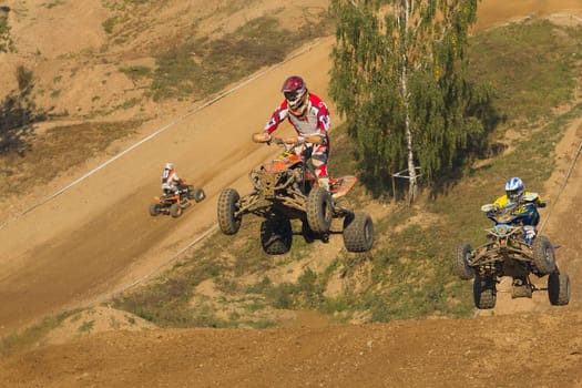 MOHELNICE, CZECH REPUBLIC - SEPTEMBER 17. Unidentified racer jump with a quad motorbike in the "Czech Republic Cup 2011"" on September 17, 2011 in the town of Mohelnice, Czech Republic."