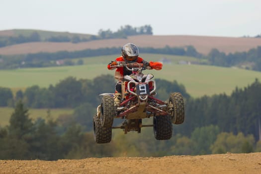 MOHELNICE, CZECH REPUBLIC - SEPTEMBER 17. Unidentified racer jump with a quad motorbike in the "Czech Republic Cup 2011"" on September 17, 2011 in the town of Mohelnice, Czech Republic."