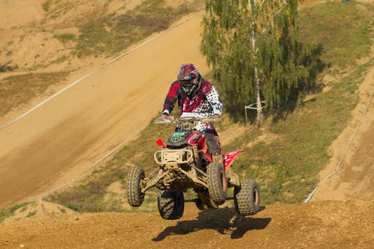 MOHELNICE, CZECH REPUBLIC - SEPTEMBER 17. Unidentified racer jump with a quad motorbike in the "Czech Republic Cup 2011"" on September 17, 2011 in the town of Mohelnice, Czech Republic."