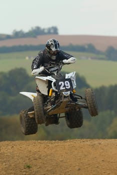MOHELNICE, CZECH REPUBLIC - SEPTEMBER 17. Unidentified racer jump with a quad motorbike in the "Czech Republic Cup 2011"" on September 17, 2011 in the town of Mohelnice, Czech Republic."