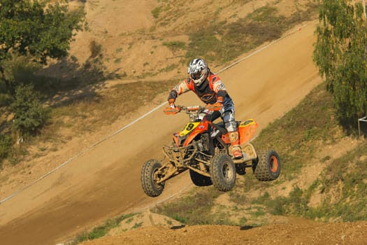 MOHELNICE, CZECH REPUBLIC - SEPTEMBER 17. Unidentified racer jump with a quad motorbike in the "Czech Republic Cup 2011"" on September 17, 2011 in the town of Mohelnice, Czech Republic."