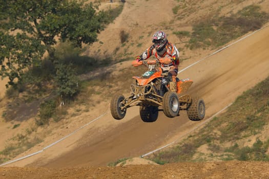MOHELNICE, CZECH REPUBLIC - SEPTEMBER 17. Unidentified racer jump with a quad motorbike in the "Czech Republic Cup 2011"" on September 17, 2011 in the town of Mohelnice, Czech Republic."