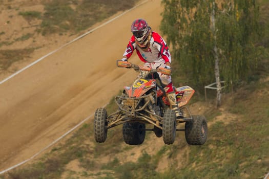 MOHELNICE, CZECH REPUBLIC - SEPTEMBER 17. Unidentified racer jump with a quad motorbike in the "Czech Republic Cup 2011"" on September 17, 2011 in the town of Mohelnice, Czech Republic."