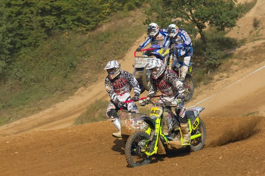MOHELNICE, CZECH REPUBLIC - SEPTEMBER 17. Unidentified racers rides a sidecar in the "Sidecarcross Championship of Czech Republic"" on September 17, 2011 in the town of Mohelnice, Czech Republic."