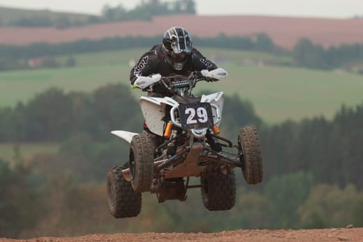 MOHELNICE, CZECH REPUBLIC - SEPTEMBER 17. Unidentified racer jump with a quad motorbike in the "Czech Republic Cup 2011"" on September 17, 2011 in the town of Mohelnice, Czech Republic."