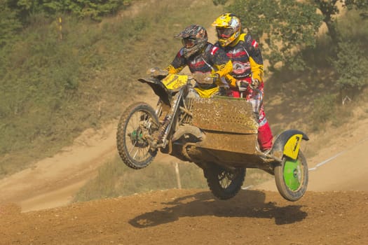 MOHELNICE, CZECH REPUBLIC - SEPTEMBER 17. Unidentified racers rides a sidecar in the "Sidecarcross Championship of Czech Republic"" on September 17, 2011 in the town of Mohelnice, Czech Republic."