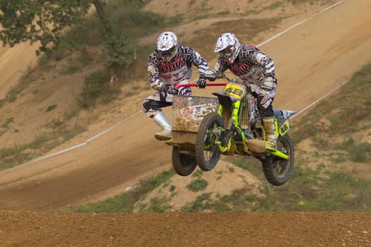 MOHELNICE, CZECH REPUBLIC - SEPTEMBER 17. Unidentified racers rides a sidecar in the "Sidecarcross Championship of Czech Republic"" on September 17, 2011 in the town of Mohelnice, Czech Republic."