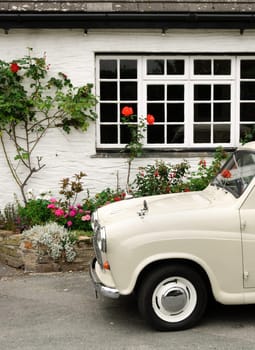 old car with roses and window Cornwall