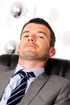 Attractive businessman is sleeping a while  from business