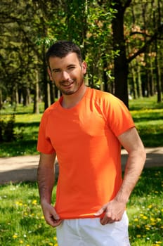 sportive and cheerful man in a natural background