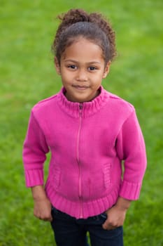 Outdoor portrait  of a cute little African Asian girl