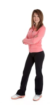 Pretty woman wearing sportswear standing with arms crossed, isolated on white.