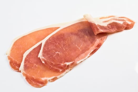 Three slices of fresh raw back bacon