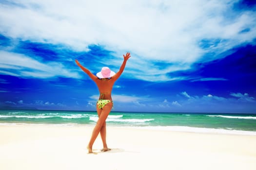 Woman have a fun time on the tropical beach