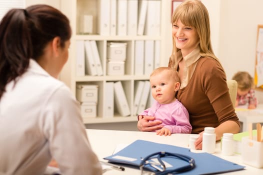 Young woman with baby girl visit pediatrician office for medical check-up