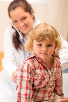 Little girl being examine with stethoscope by pediatrician