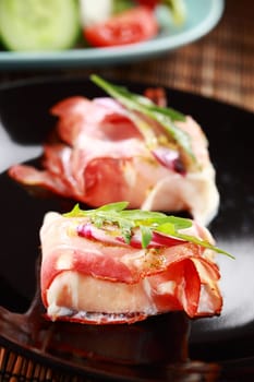 Prosciutto cheese rolls with arugula