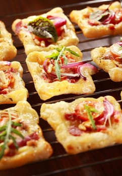 Puff pastry with cheese, tomato and vegetables