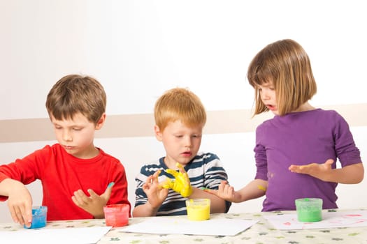 Children paint with finger paints