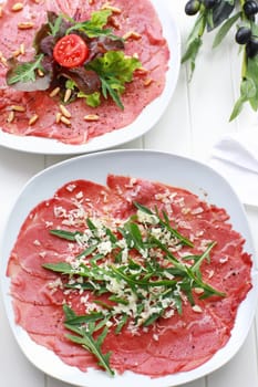 Carpaccio with rocket and cheesse