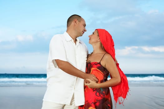 Young loving couple have a fun on the beach
