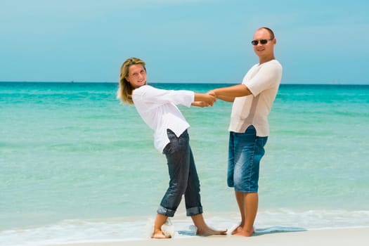 Young couple on the tropical beach
