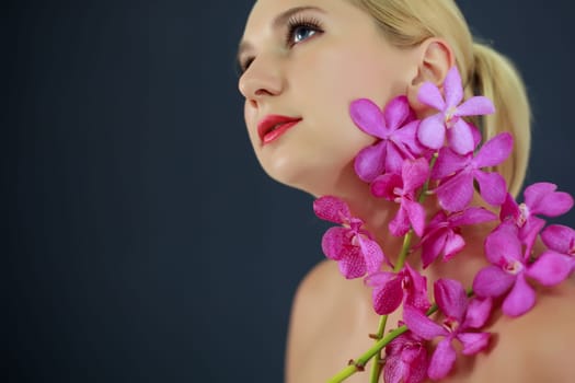 Portrait of young woman with hairstyle and flowers