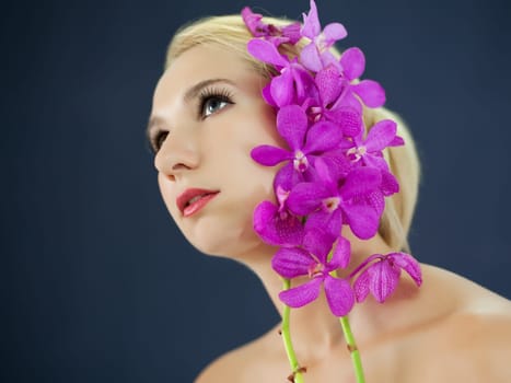 Portrait of young woman with hairstyle and flowers