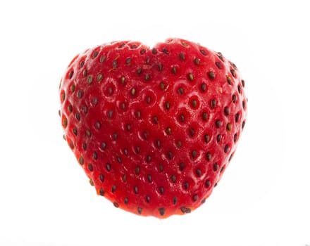 Freshly sliced strawberry in shape of heart isolated against white