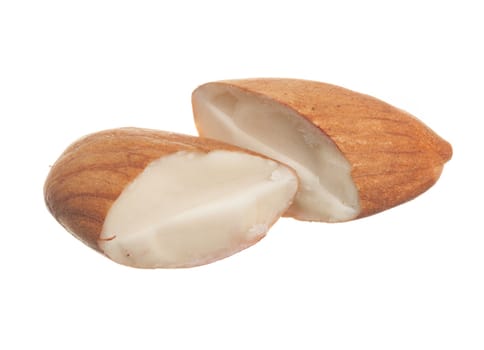 Close shot of half a hazelnut isolated against white background