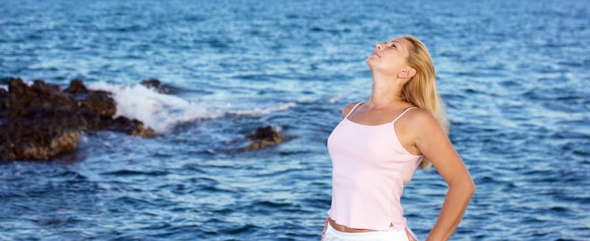 Young woman enjoy near the ocean.