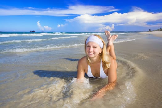 Young woman on the tropical beach.