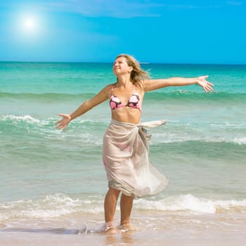 Young woman enjoying the sea breeze