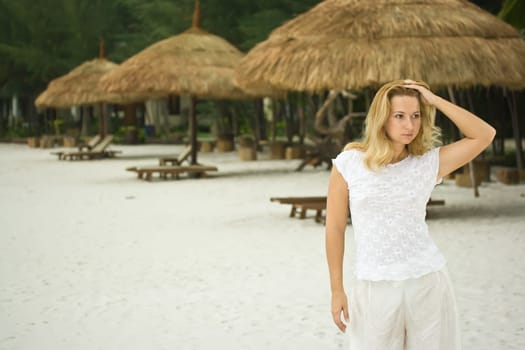 Young woman posing on the tropical beach
