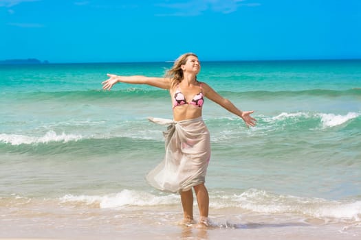 Young woman enjoying the sea breeze