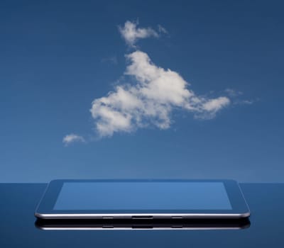 Cloud computing concept. Tablet computer and cloud.