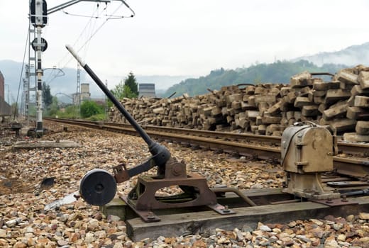 Close up of a changing of rail-way crossings lever, Old weathered rusty grungy railroad points switch mechanical manual railway turnout arrow Asturias Spain