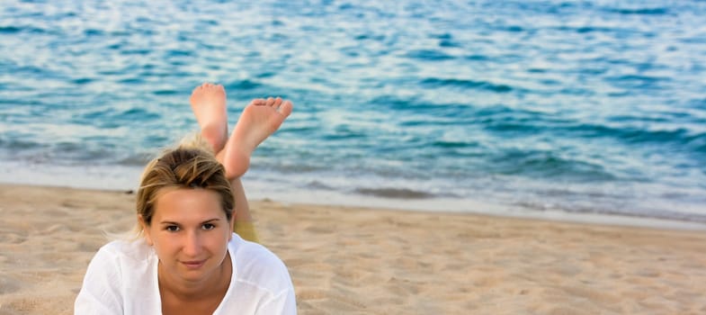 Young woman on the tropical beach