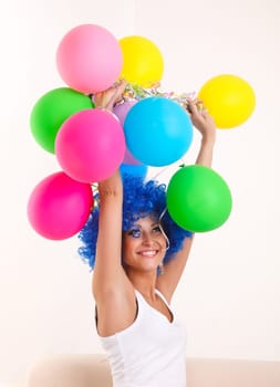 Girl clown with colourful balloons.