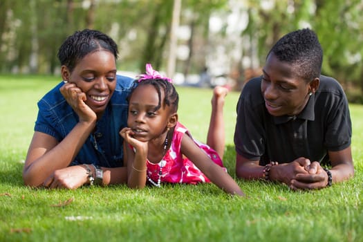 Portrait of a adorable african mother with her childrens in the garden
